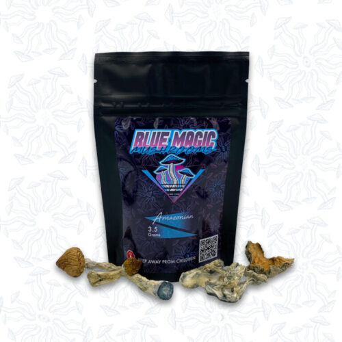 A sealed package of magic mushrooms behind a small pile of dried thin magic mushrooms